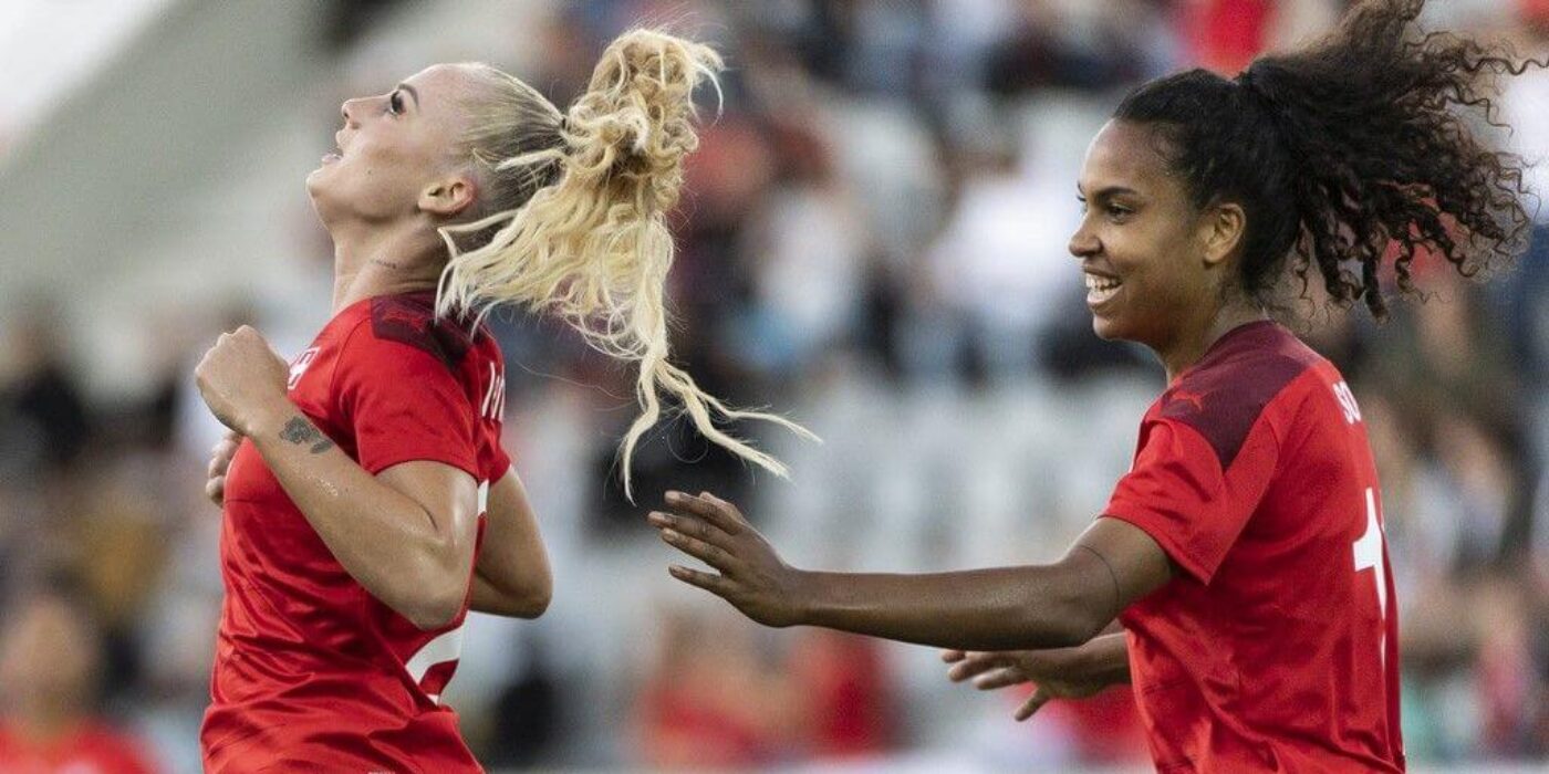 Swiss Alisha Lehmann, left, celebrates after scoring to 1:0 next to teammate Coumba Sow, during the FIFA Women's World Cup 2023 qualifying round group G soccer match between Switzerland and Lithuania at the Stockhorn Arena in Thun, Switzerland, on Friday, September 17, 2021. (KEYSTONE/Alessandro della Valle)